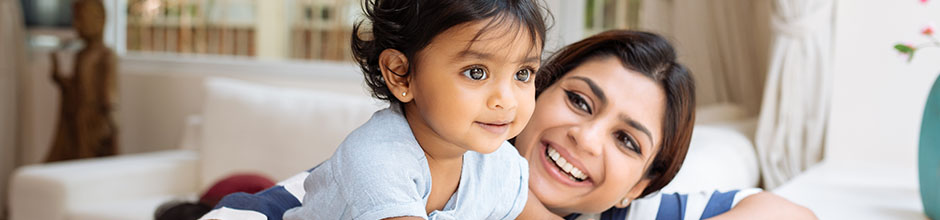 Image of mother and daughter smiling.