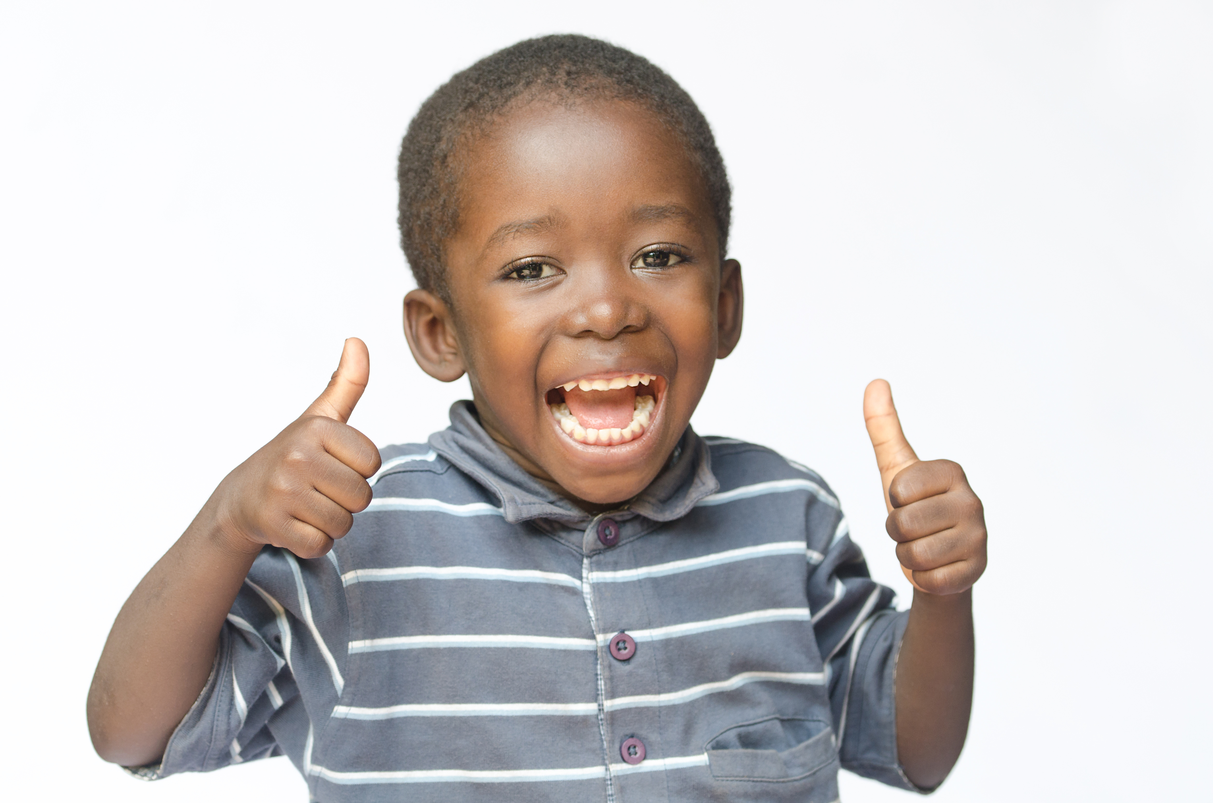 image of a toddler giving a thumbs up